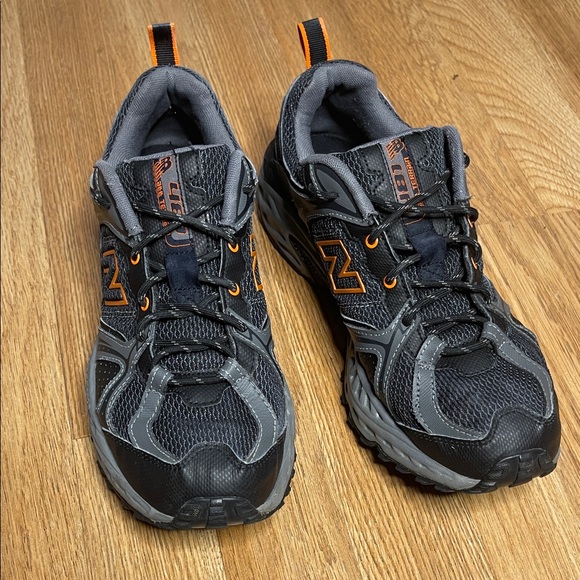 New Balance Men's Black and Gray Athletic Shoes with Orange Highlights